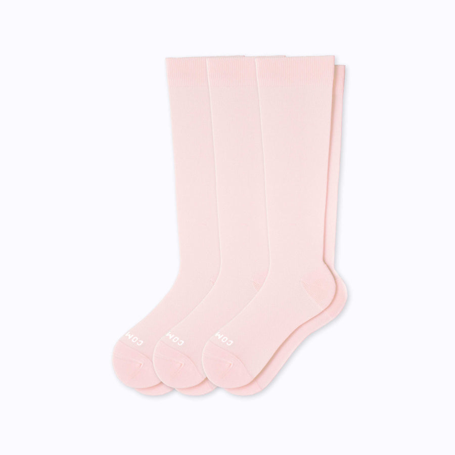 A 3-pack of nylon  knee-high compression socks in rose solid