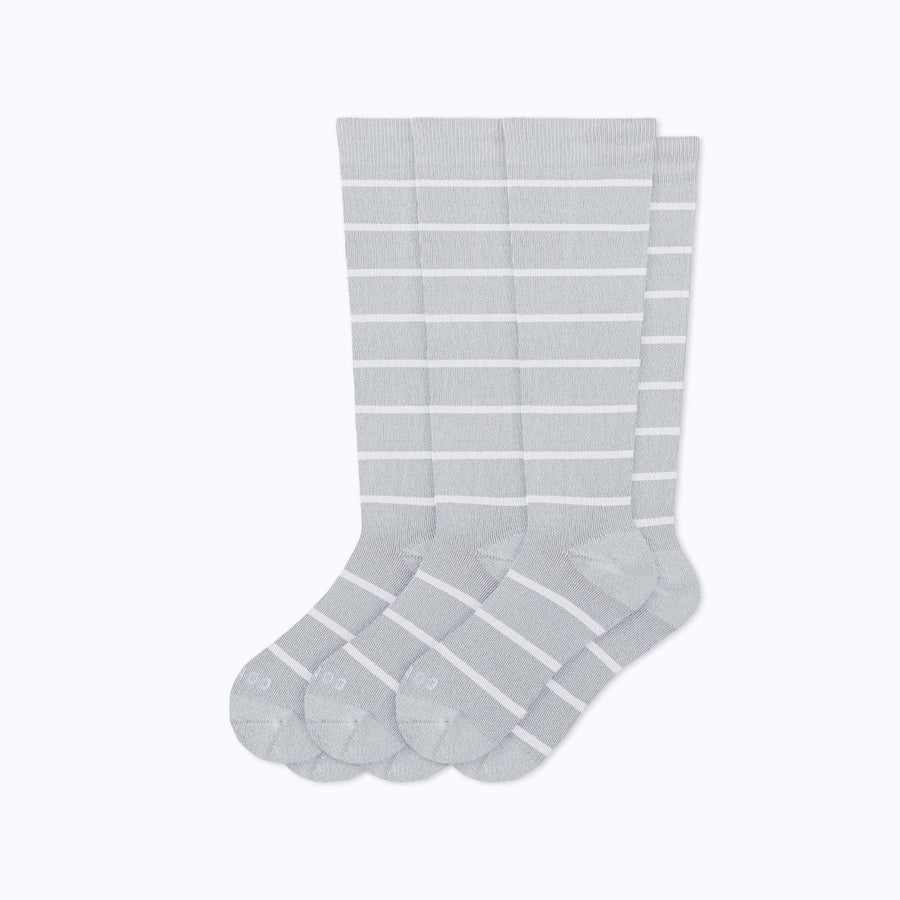 A 3-pack nylon knee high compression socks in heather-white stripes