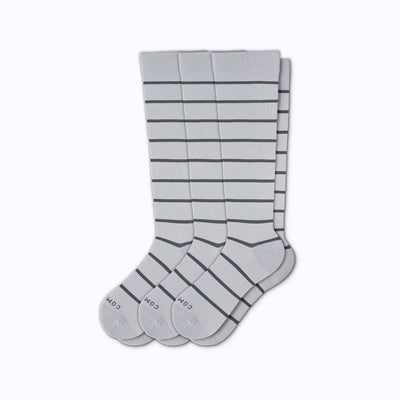 A 3-pack nylon knee high compression socks in grey-charcoal stripes