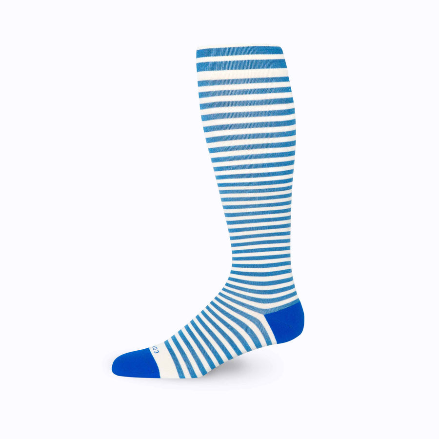 Side view of knee high compression socks in black-blue-sage