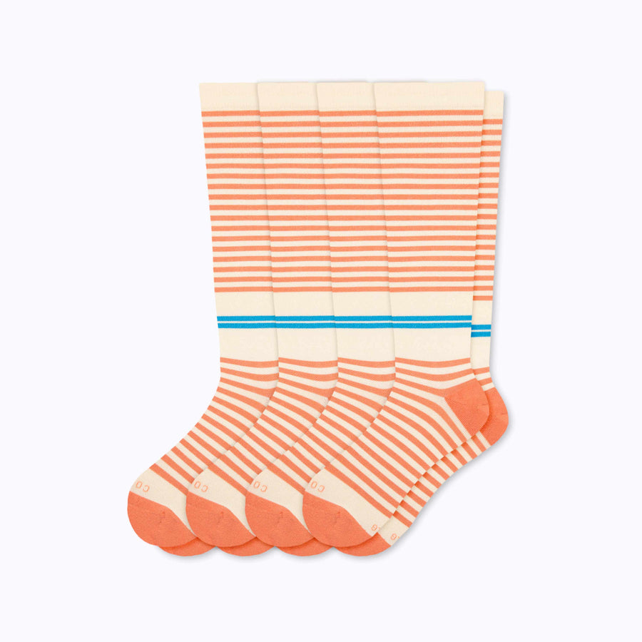 A 4-pack of cotton compression socks in cream-terra-cotta tencel stripe