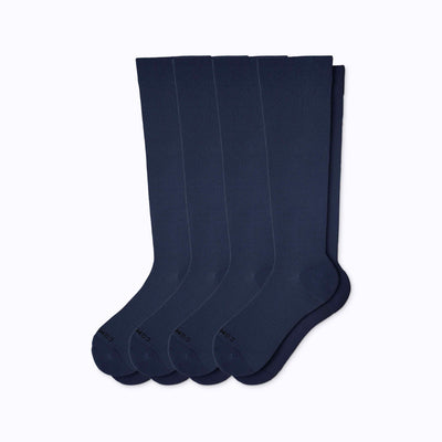 A 4-pack nylon knee high compression socks in navy solid