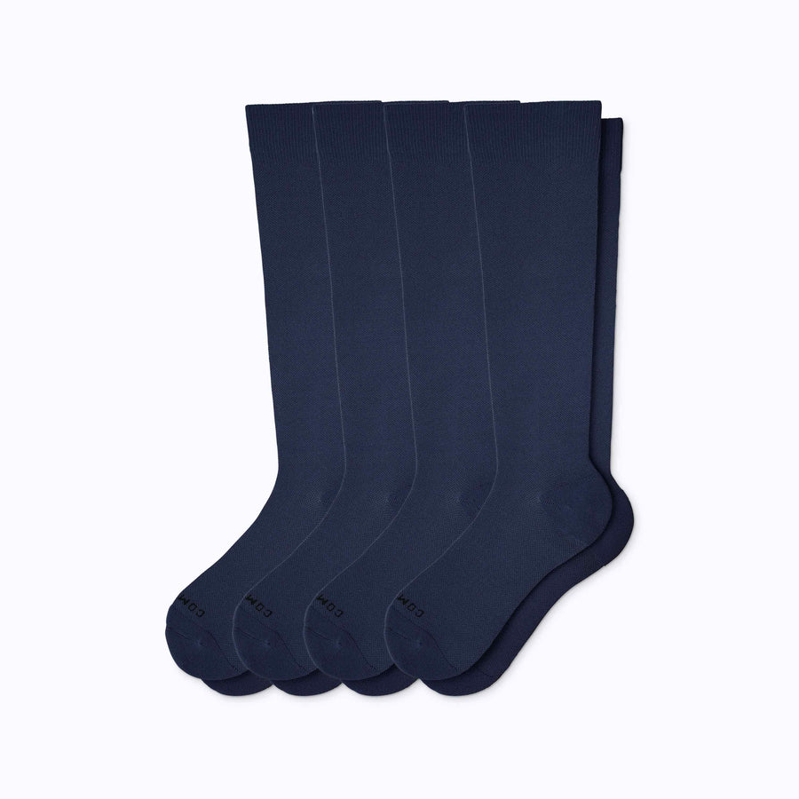 A 4-pack nylon knee high compression socks in navy solid
