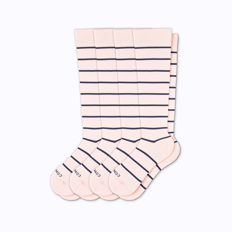 A 4-pack nylon knee high compression socks in rose-navy stripes