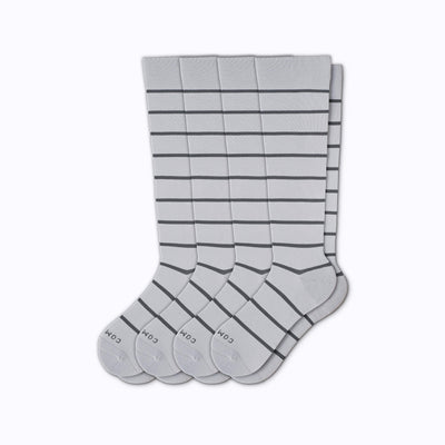 A 4-pack nylon knee high compression socks in grey-charcoal stripes