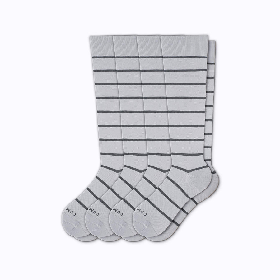 A 4-pack nylon knee high compression socks in grey-charcoal stripes