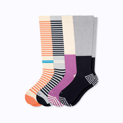 A 4-pack of cotton compression socks in black-grey-mulberry-terra-cotta tencel