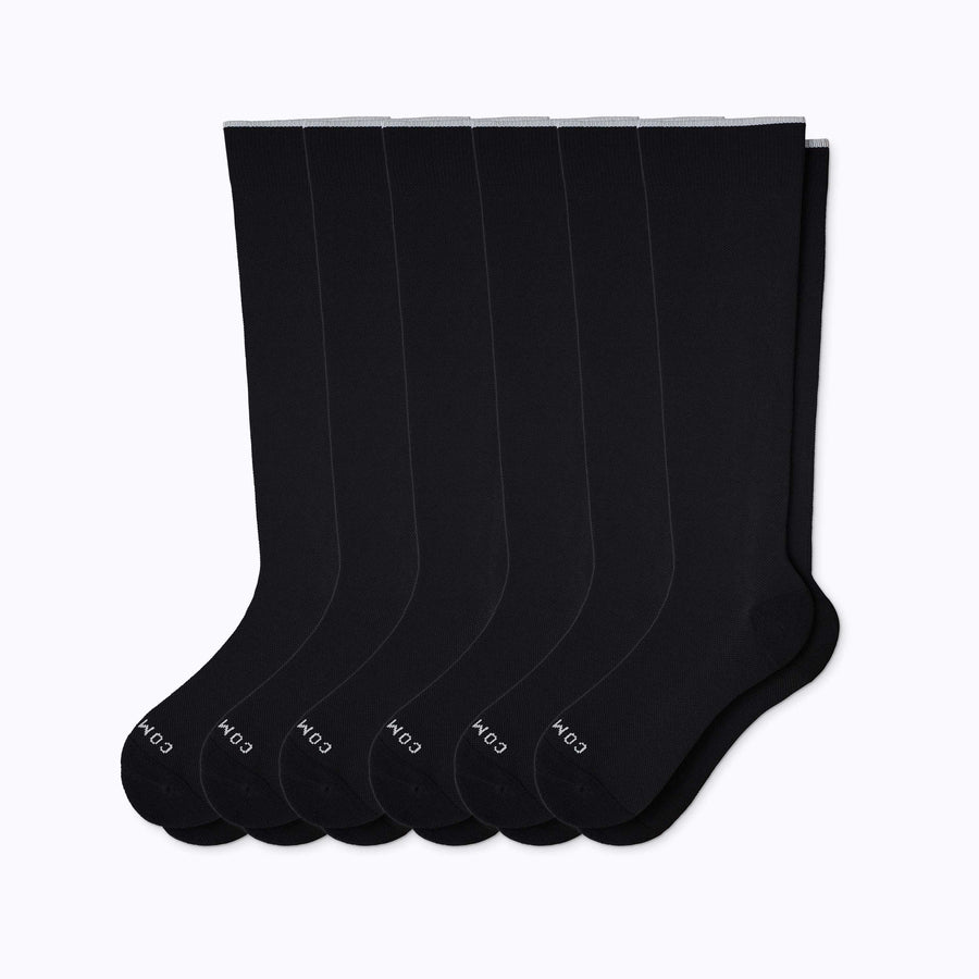 A 6-pack nylon knee high compression socks in black solid