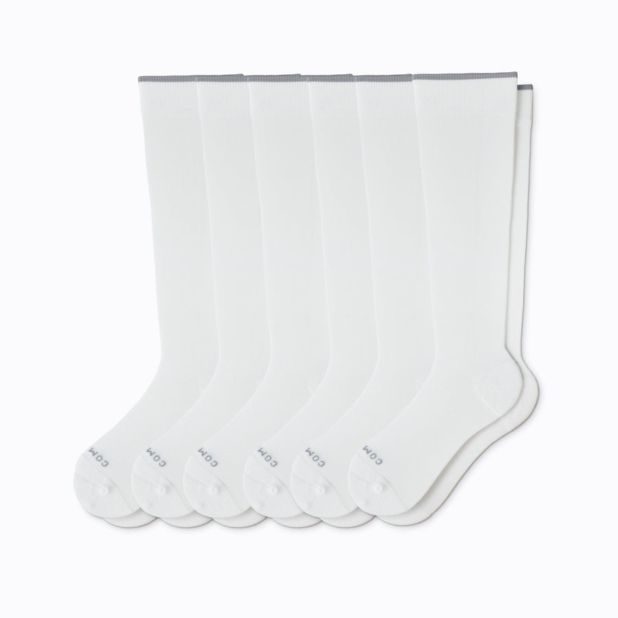 A 6-pack nylon knee high compression socks in white solid