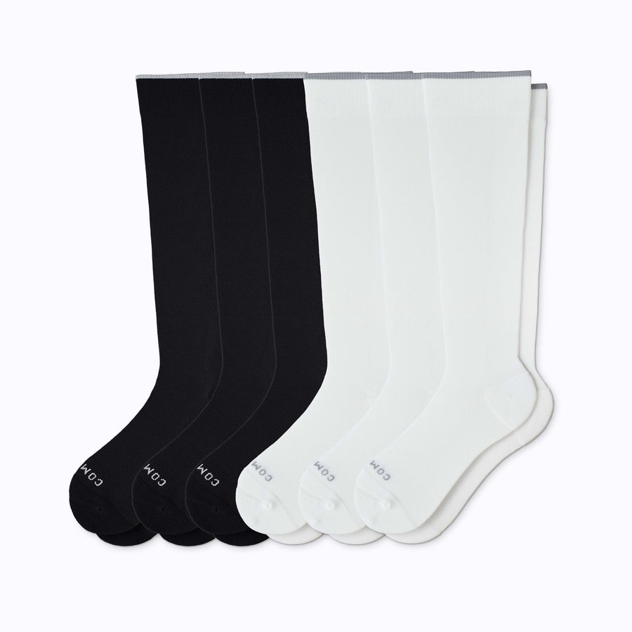 A 6-pack nylon knee high compression socks in black-white solid