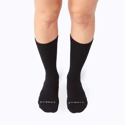 Front view of feet wearing a combed cotton in black solid