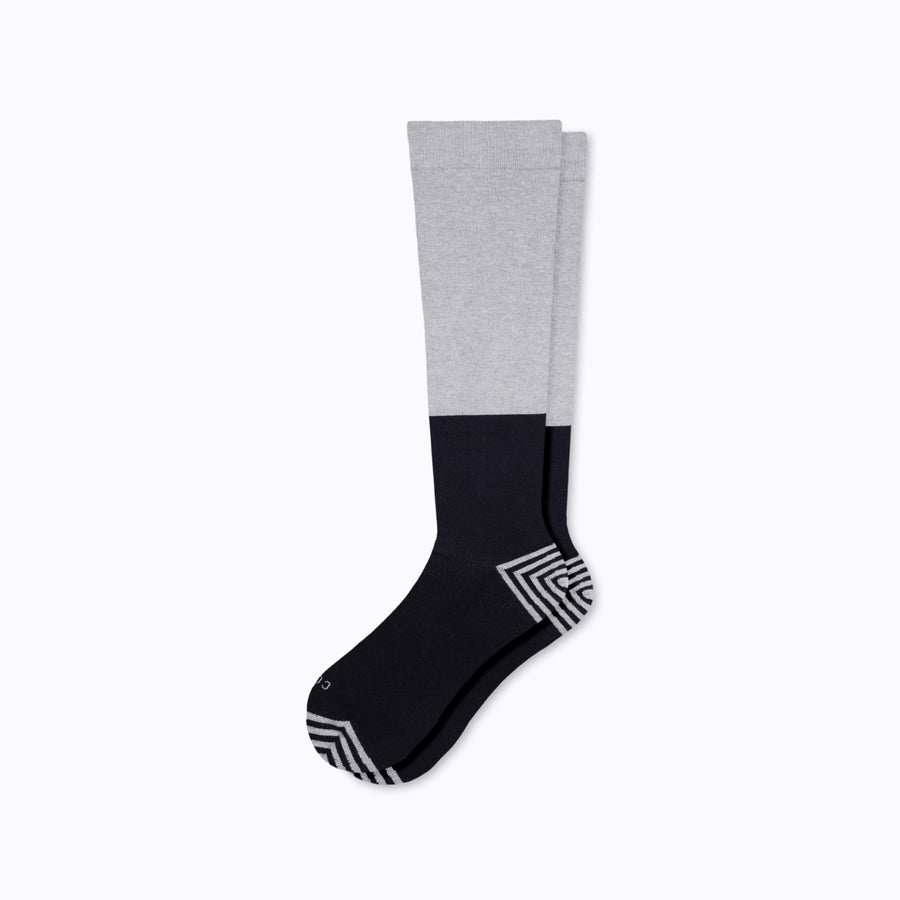 A pair of knee high cotton compression socks in grey-black tencel colorblock