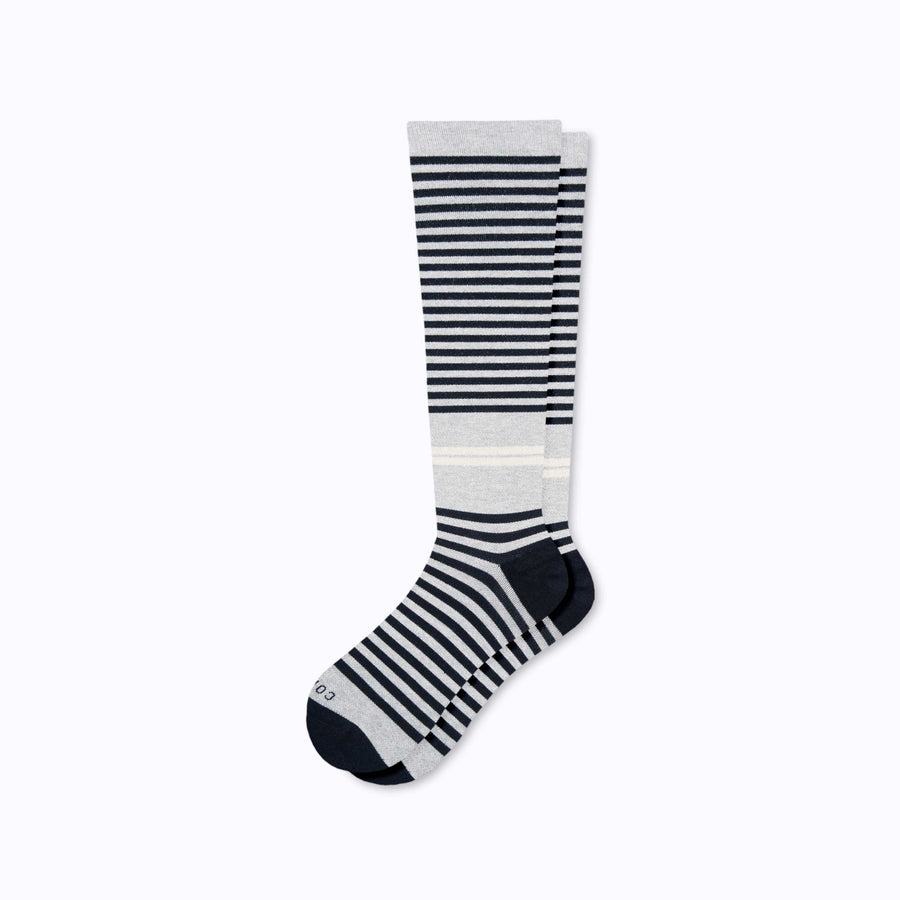 A pair of knee high cotton compression socks in grey-black tencel stripe