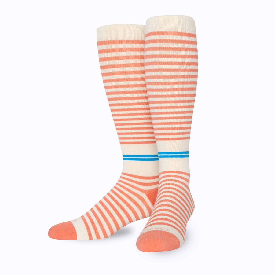 Front view of knee high cotton compression socks in cream-terra-cota tencel stripe