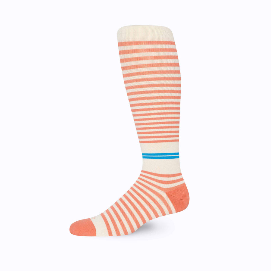 Side view of knee high cotton compression socks in cream-terra-cota tencel stripe