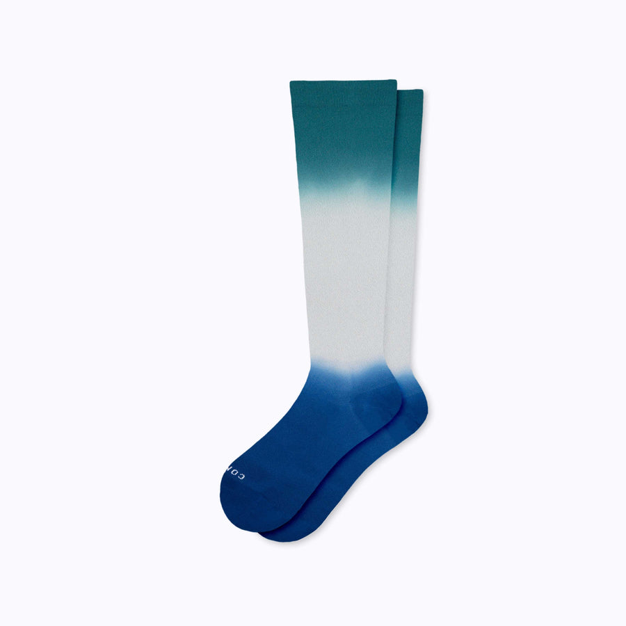 A pair of  knee high nylon socks in grey-navy-botanical double dip ombre