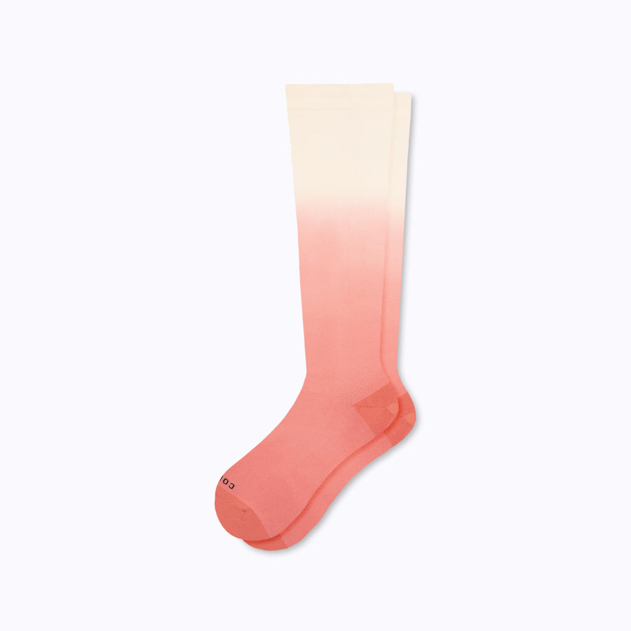 A pair of knee high nylon socks in cream-terracotta ombre 