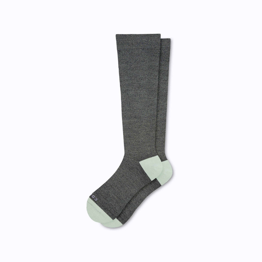 A pair of merino knee high compression socks in black-sage tencel stripes