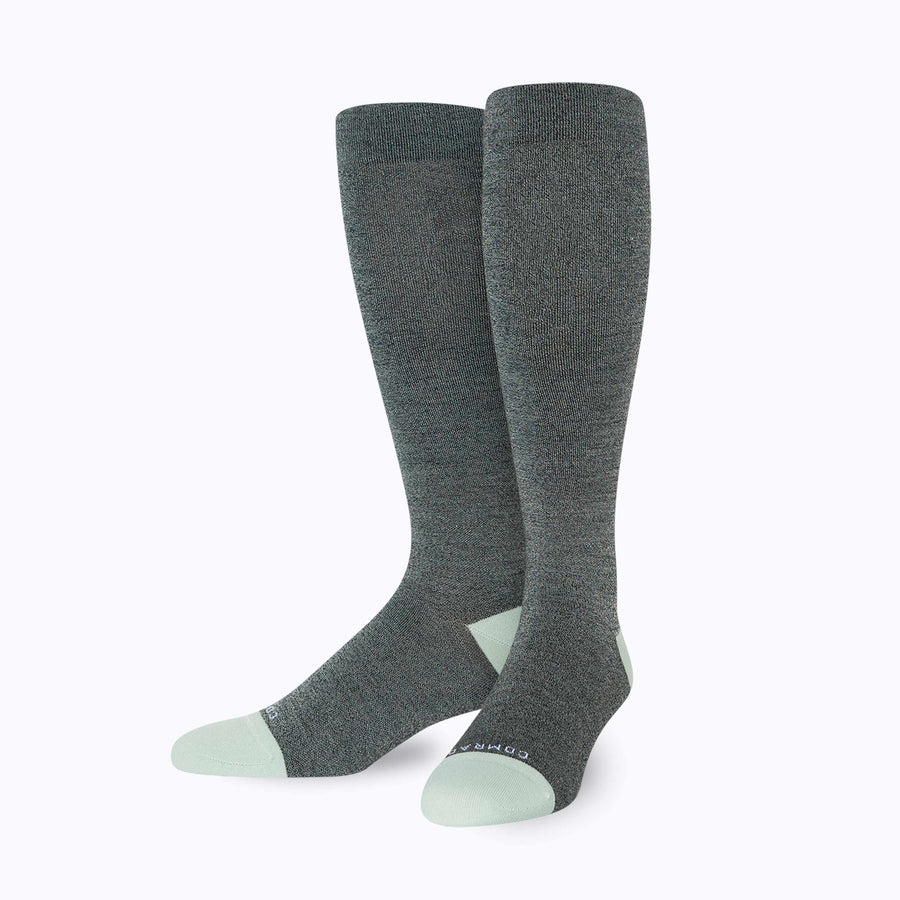 Front view of merino knee high compression socks in black-sage tencel stripes