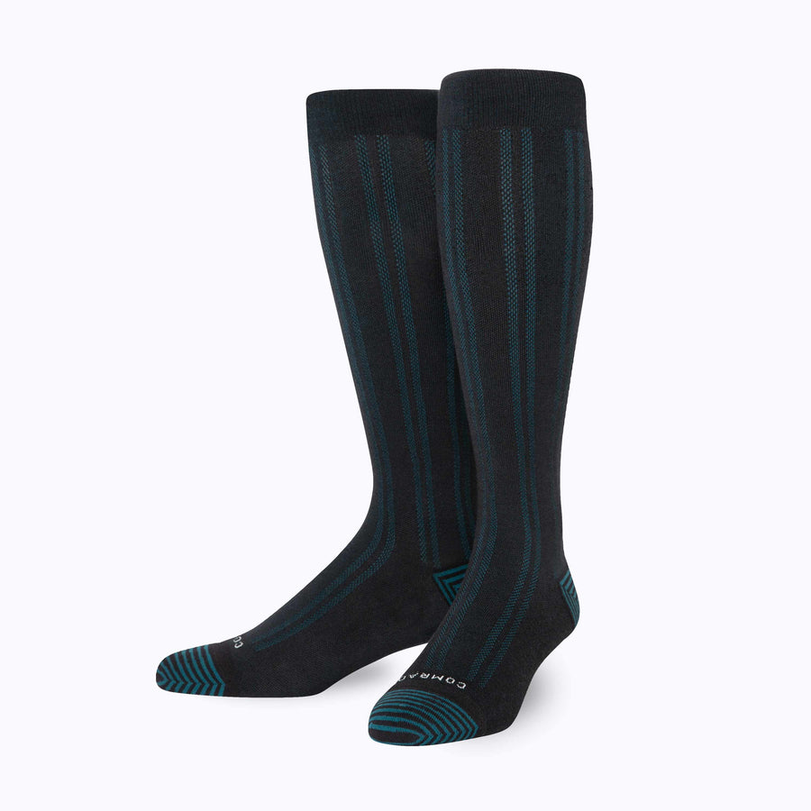 Front view of merino knee high compression socks in black-botanical tencel stripes