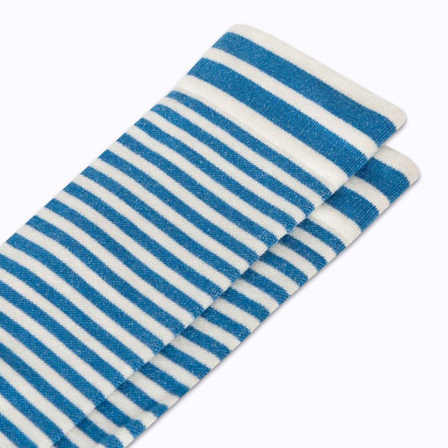 Close up view of merino knee high compression socks in blue-sand tencel stripes